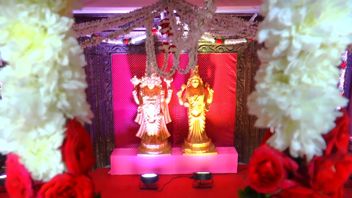 Wedding reception decor with florals and warm lighting